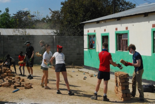 Hurst Expedition 2024 to Cameron's Orphanage 12 Moving bricks