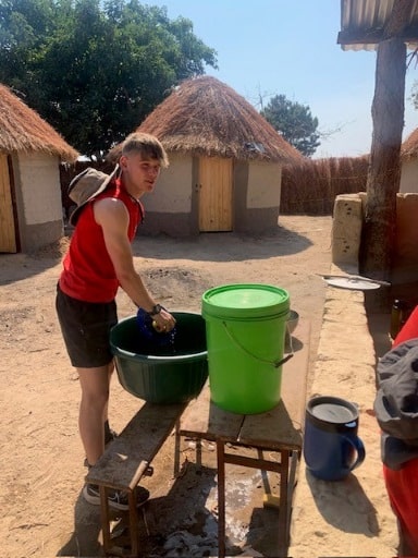 Hurst Expedition 2024 to Cameron's Orphanage 23 Washing up