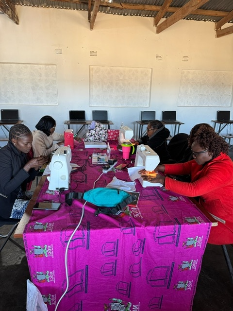Adult Expedition July 2025 30 Teaching teachers how to use a sewing machine